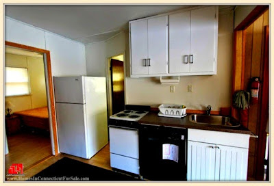 Prepare all your favorite dishes in the fully functional kitchen of this 3 bedroom Danbury Ct lakefront home for sale.
