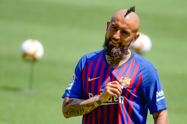 Barcelona unveils new signing Arturo Vidal