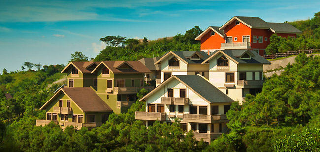 The Swiss Village has low-rise villas in the style of Swiss chalets surrounded by the green pine trees.