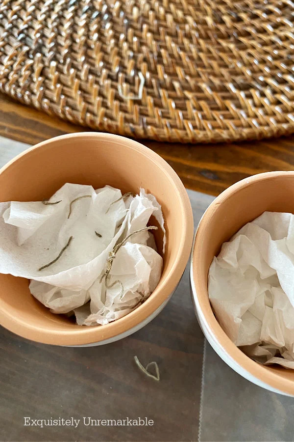 Paper stuffed into small clay pots