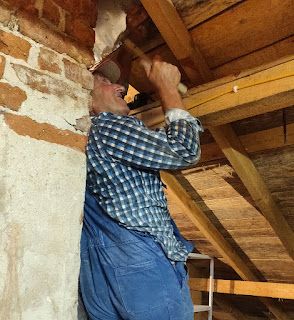 Fitting some metal to seal around the chimneys