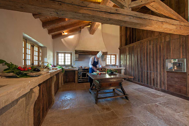 Picture of luxury kitchen with stone and wood walls and furniture