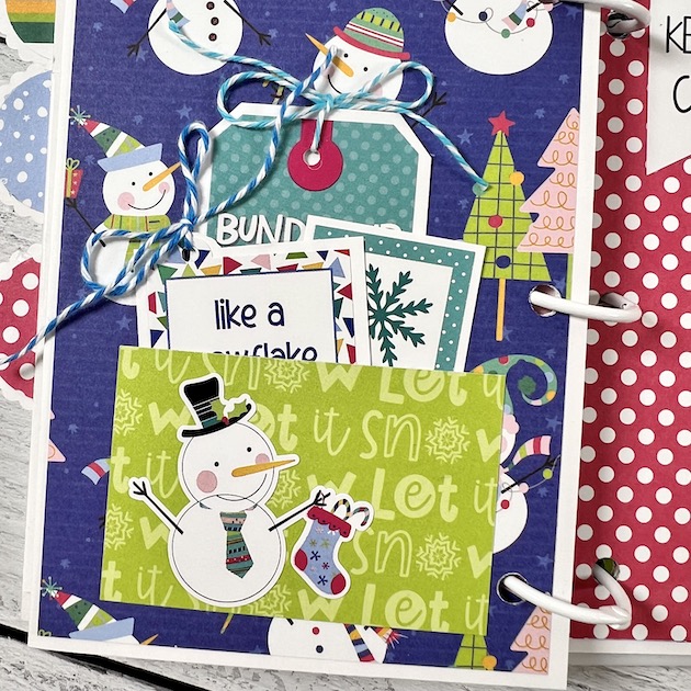 Winter Scrapbook Album page with snowmen, pocket, tags, & twine