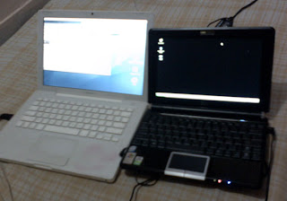 Asus Eee PC 1000H compared to an Apple MacBook