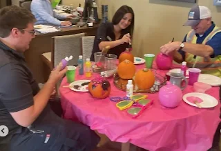 Heights Amesbury staff painting pumpkins