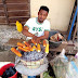 Picture of Corper Roasting Corn On The Street Trend Online