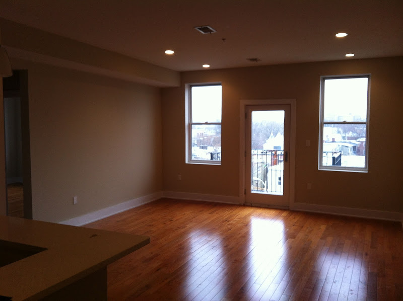 It has gleaming hardwood floors. title=