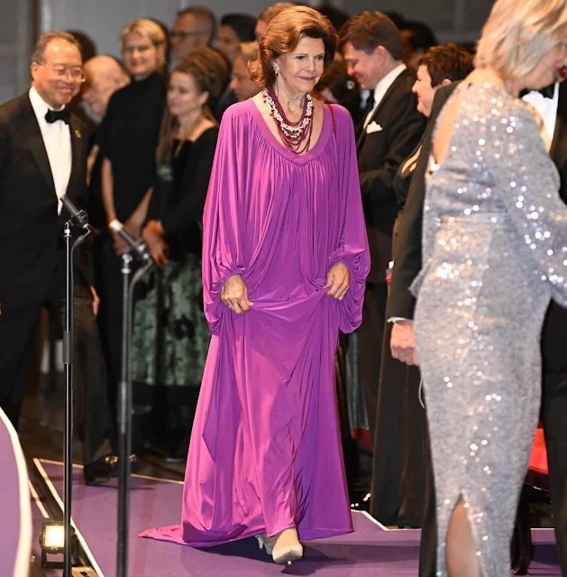 Queen Silvia attended the award ceremony of The Birgit Nilsson Prize. Cellist Yo-Yo Ma. Queen Silvia wore a purple gown