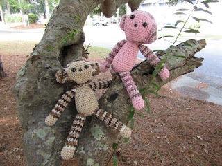 Handmade monkeys sitting in a tree