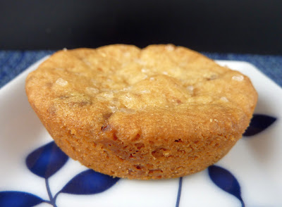 Peanut Butter Shortbread cookie, baked in a muffin pan. Photographed on a white plate with blue leaves