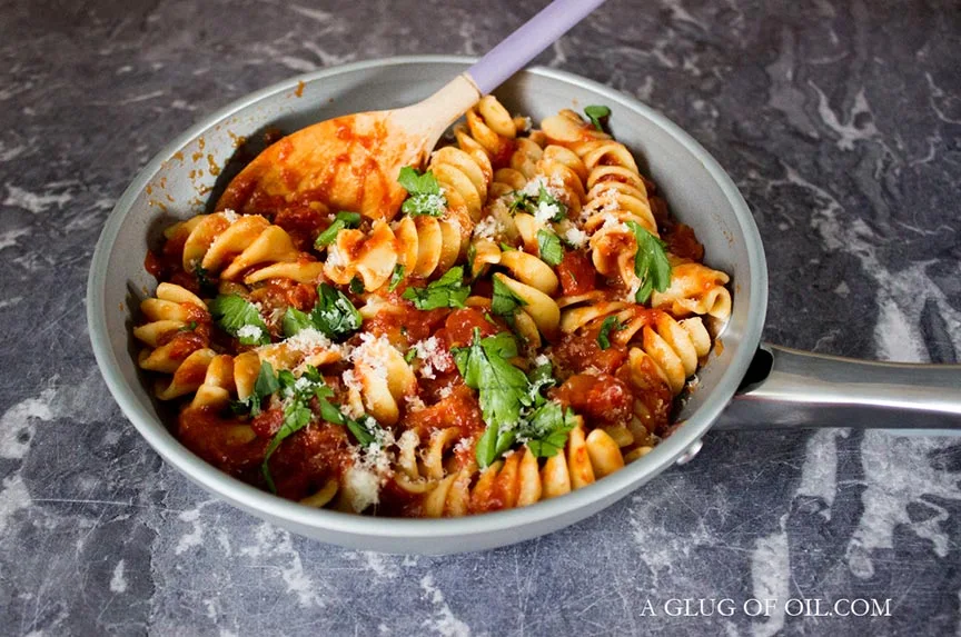 Roasted red pepper sauce in a pan with pasta