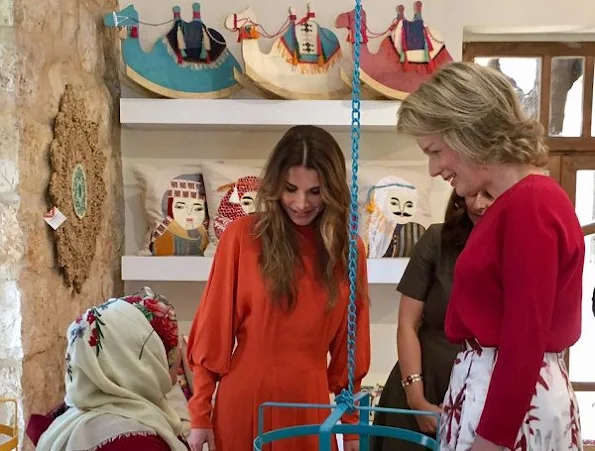 Diane von Furstenberg Flirty Elaphe clutch, Natan dress, dress made by "regular" Jordanian women with local fabrics