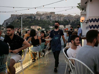 GREECE IMPOSES BAR AND RESTAURANT CURFEW AS COUNTRY HIT BY SECOND WAVE