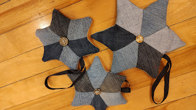 Three denim star ornaments