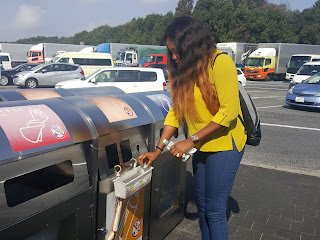 Adesuwa Obasuyi disposing trash responsibly at a truck stop in Japan