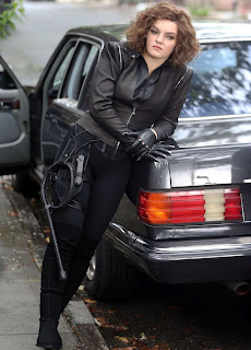 Camren Bicondova posing for picture with car