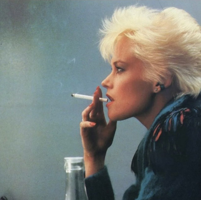 Melanie Griffith ,smoking with that mid-'80s short haircut that everyone wore back then - Body Double (1984)