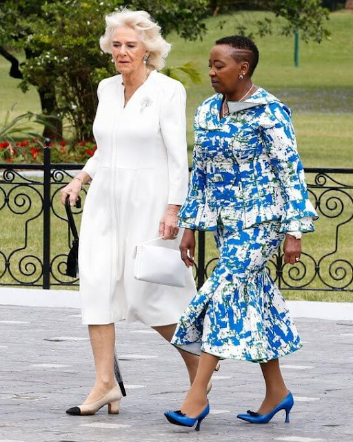 Queen Camilla wore a white dress and diamond brooch. President William Ruto and First Lady Rachel Ruto