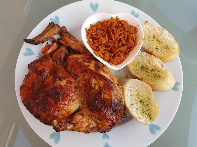 Nando's at home, chicken, garlic bread and spicy rice.