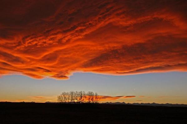 Lenticular clouds over the Flatirons at sunrise