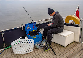 Photo of Phil setting up one of his fishing rods