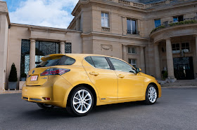 Rear 3/4 view of 2011 Lexus CT 200h Hybrid parked in front of building