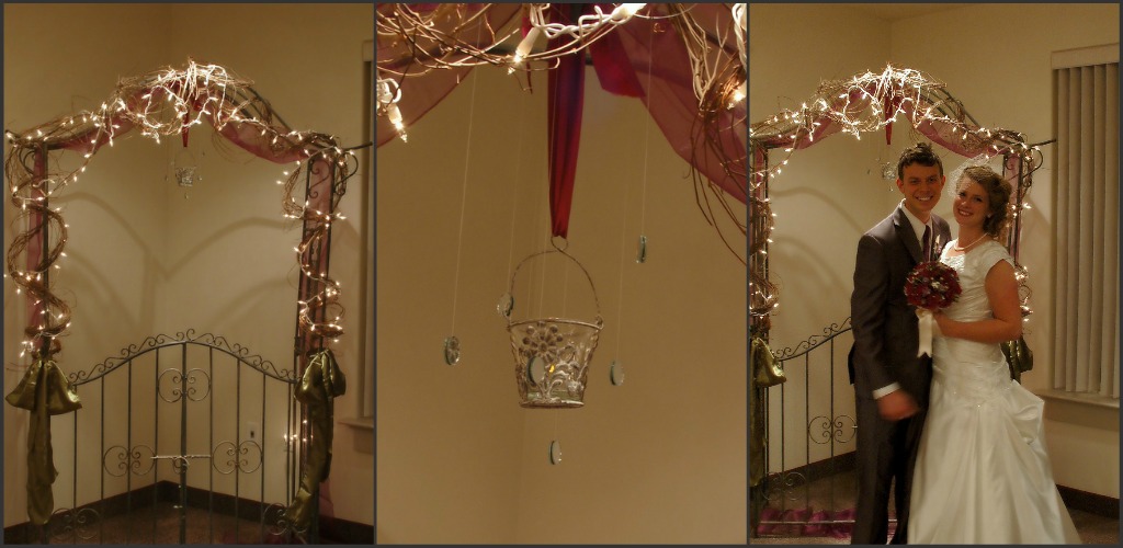 The archway decorated with rustic grapevine twinkle lights and flowing 