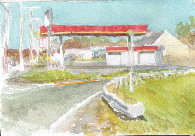 Watercolor sketch of abandoned gas station with flat red roof and highway guard rail in foreground.