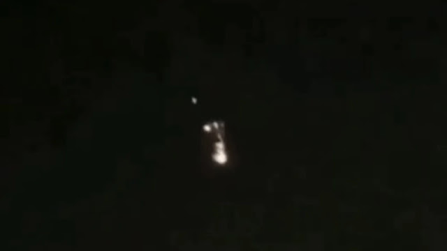 This UFO sighting happened over the UK, it breaks into smaller UFOs and they start to fly.