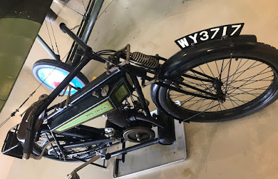 Small motorcycle on display in museum.