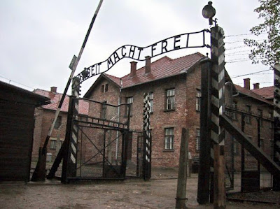 Entrance gate with lettering Arbeit macht frei Auschwitz Concentration Camp