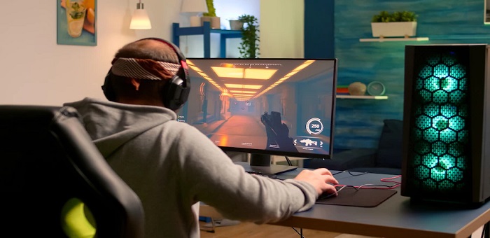 gamer performing cyber video games using professional headphones