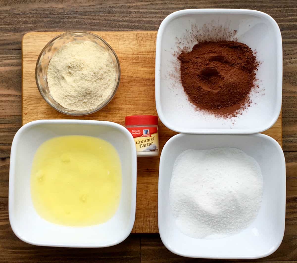 Mousse cake ingredients on a cutting board.