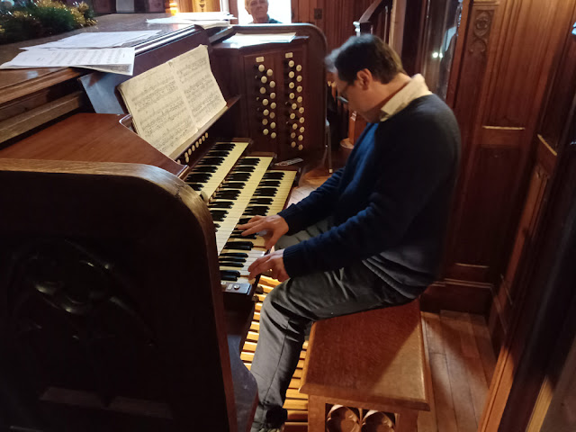 The organist from Eglise St Cyr et St Julitte playing the house organ at the Chateau de Cande, Indre et Loire, France. Photo by Loire Valley Time Travel.