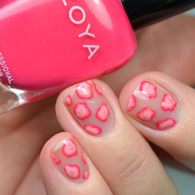 pink blobs of nail polish creating abstract floral nail art