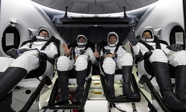 The Crew-6 astronauts pose for the camera after the hatch is opened on their Endeavour capsule once she was safely placed aboard a SpaceX recovery vessel deployed off the coast of Jacksonville, Florida...on September 4, 2023 (Eastern Time).