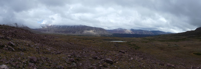 070: long row of mountainous bits topped in cloud