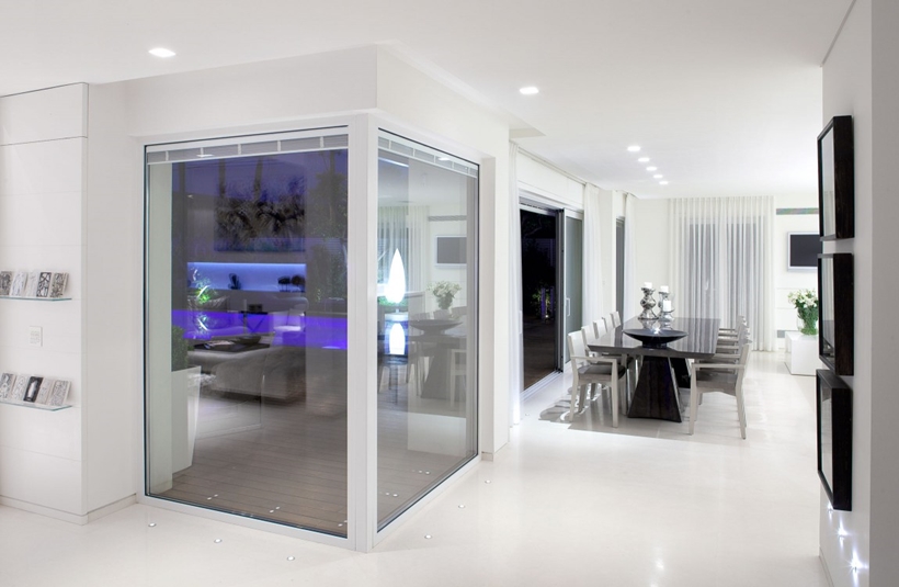 Corner glass wall and White interior design in modern Sea Shell home