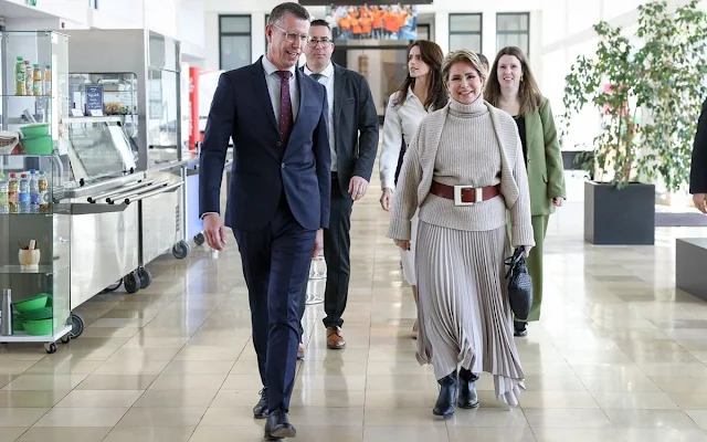 Grand Duchess Maria Teresa wore a wool and cashmere cardigan and sleeveless sweater by Barbara Bui. Joseph Ade midi skirt