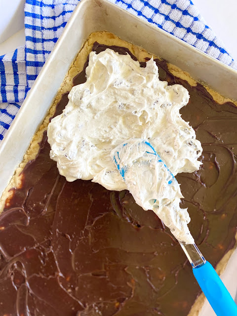 Oreo Fluff Bars....shortbread crust, chocolate frosting, Oreo fluff made into a layered dessert.