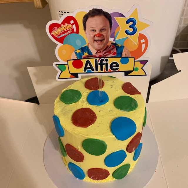 Bespoke Mr Tumble birthday cake with personalised topper