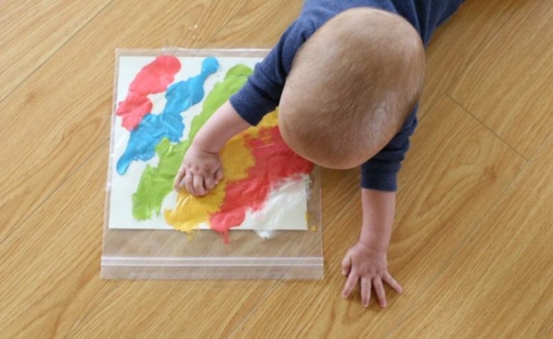 Mess free painting for babies using a plastic bag.