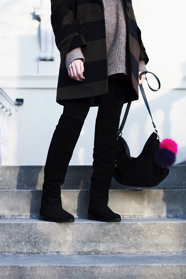 Outfit of the day by Victoria of thewindofinspiration.com, wearing Asos Striped Coat, Ralph Lauren Chunky Sweater, Pieces Jeggings, Charles by Charles David Over the Knee Boots, Eileen Fisher Suede Bag, Asos Sunglasses, Michael Kors Fur Pom-Pom Keychain.