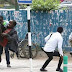 Photos: Kenyan journalist risks his life to save disabled beggar from a swarm of angry bees outside Supreme Court