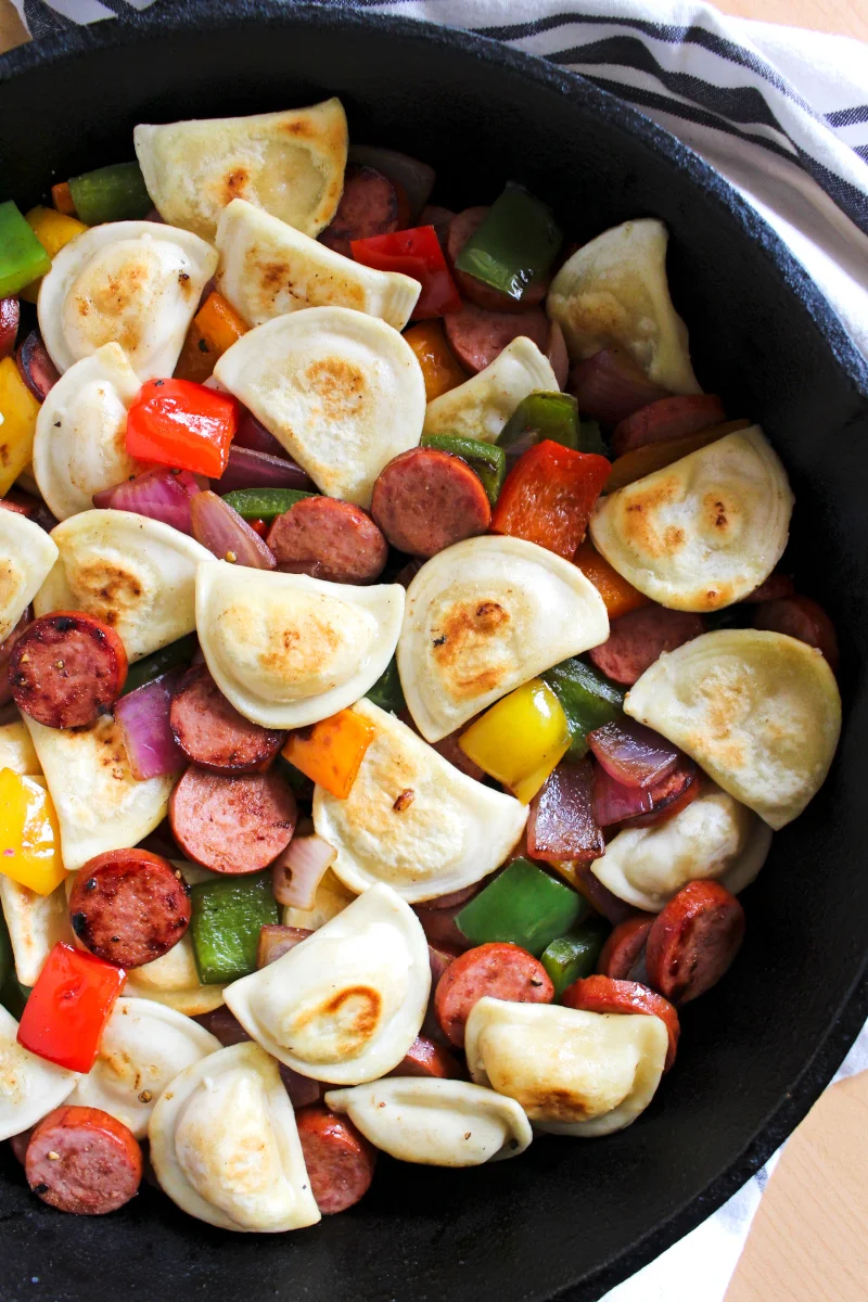 Kielbasa, Pepper, Onion, and Pierogy Hash is a simple and easy to prepare recipe that is on the table in less than 30 minutes. It's the perfect family meal for busy days!