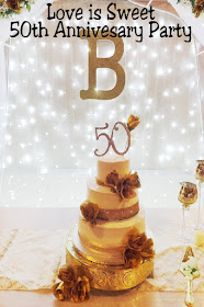 Come celebrate a beautiful 50th anniversary party where Love is Sweet.  See all the details on how we created a yummy candy table, food table, cake table, and dessert table and beautiful decor.