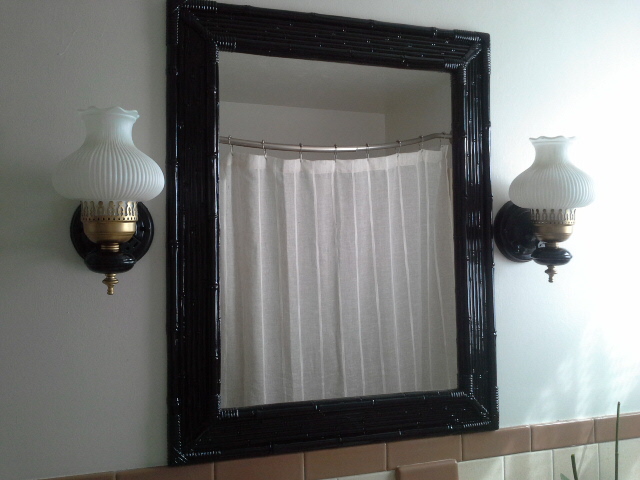 Vintage Bathroom Makeover black bamboo mirror gold and black light fixture