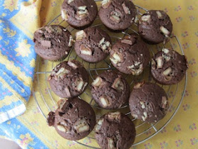 Food Lust People Love: Twix Muffins combine a sweet chocolate batter with crunchy Twix bars inside and on top for a batch of great snack muffins the whole family will love.