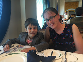 Family eating dinner on a cruise ship