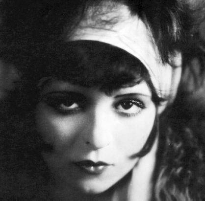 If I could learn to tie my hair up with a scarf like Clara Bow in these 
